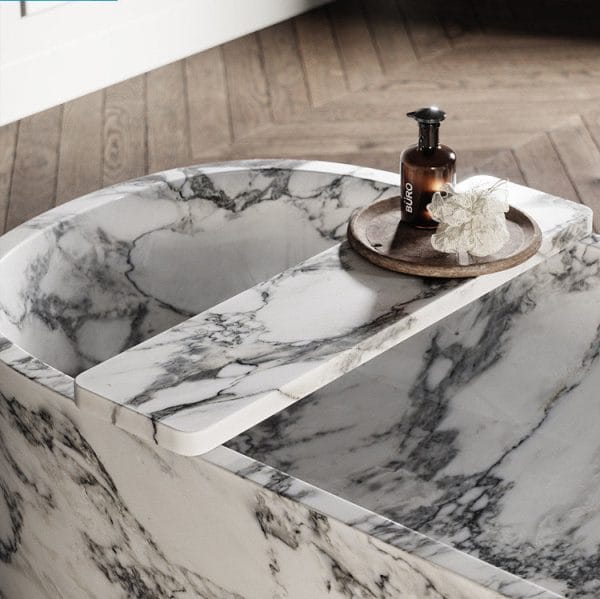 Close-up of Daen Bend Muse Arabescato Marble Bath 1700mm, highlighting luxurious polished interior and unique Italian marble veining.