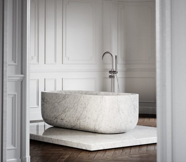 Daen Bend Carrara Marble Freestanding Bath 1780mm in a classic white-paneled bathroom with modern chrome fixtures.