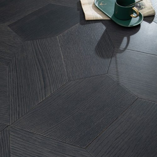 Close-up of Obsidian Path floorboards showing pentagonal dark wood pattern - "Detailed view of Obsidian Path's pentagonal pattern, adding depth and sophistication to any space.