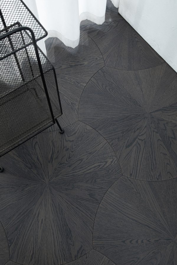 Obsidian Oak Lilypad floorboards with geometric lily pad pattern in a dark-stained finish.