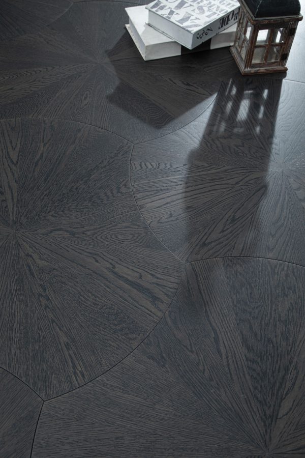 Close-up of Obsidian Oak Lilypad floorboards with intricate dark-stained oak lily pad pattern.