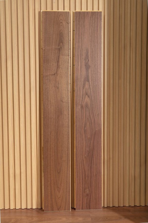 Two pieces of American Black Walnut Floorboard against a backdrop.