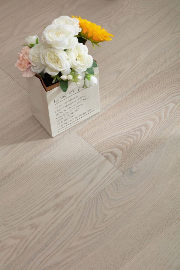 White Oak Floorboard installation with decorative plant.