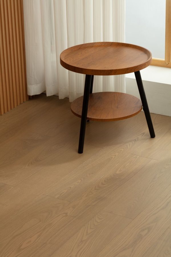 Oak floorboards showcasing a warm caramel hue, emphasizing the natural grain pattern.