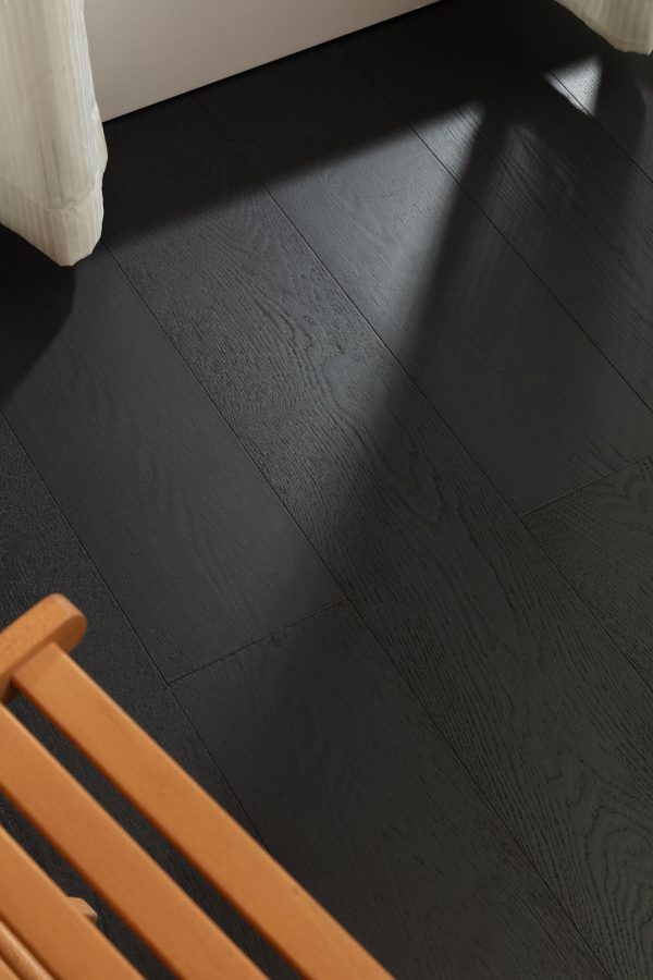 Close-up of Obsidian Oak floorboard with deep black finish.