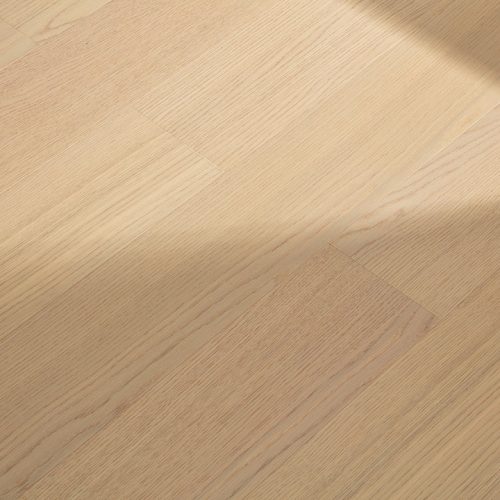 Large natural oak classic floorboard close-up, showing the light wood grain texture and smooth finish.