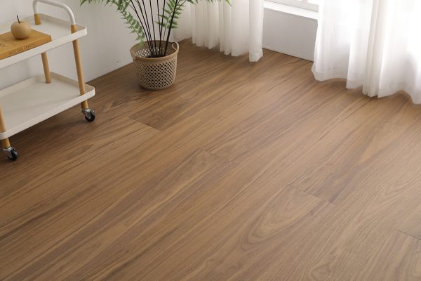 Close-up of walnut floorboards with rich wood grain.