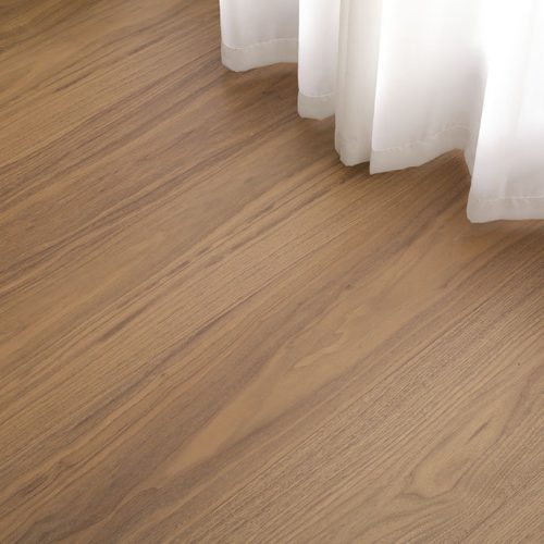 Walnut wood floorboards with a warm, natural finish.