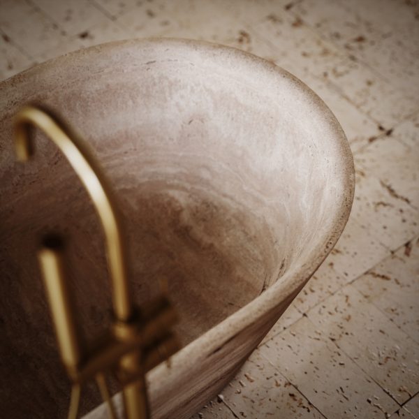 Close-up of the Daen Linear Classic Travertine Freestanding Bath 1700mm, highlighting the natural stone veining and smooth curved edges.