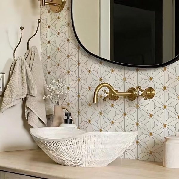 Elegant bathroom featuring White Hana Marble Mosaic tile with brass accents.